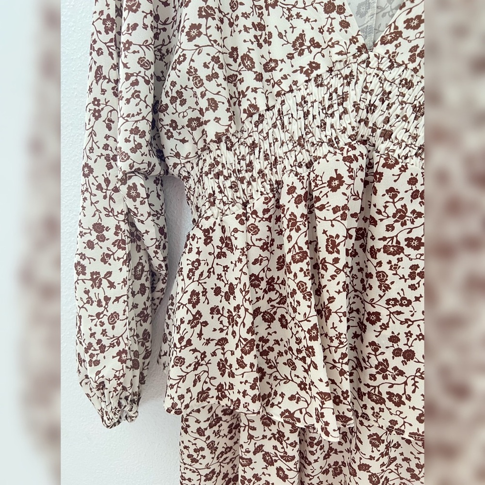 Flower detailed dress. Flowy with a ruffle in the waist. New, never used.